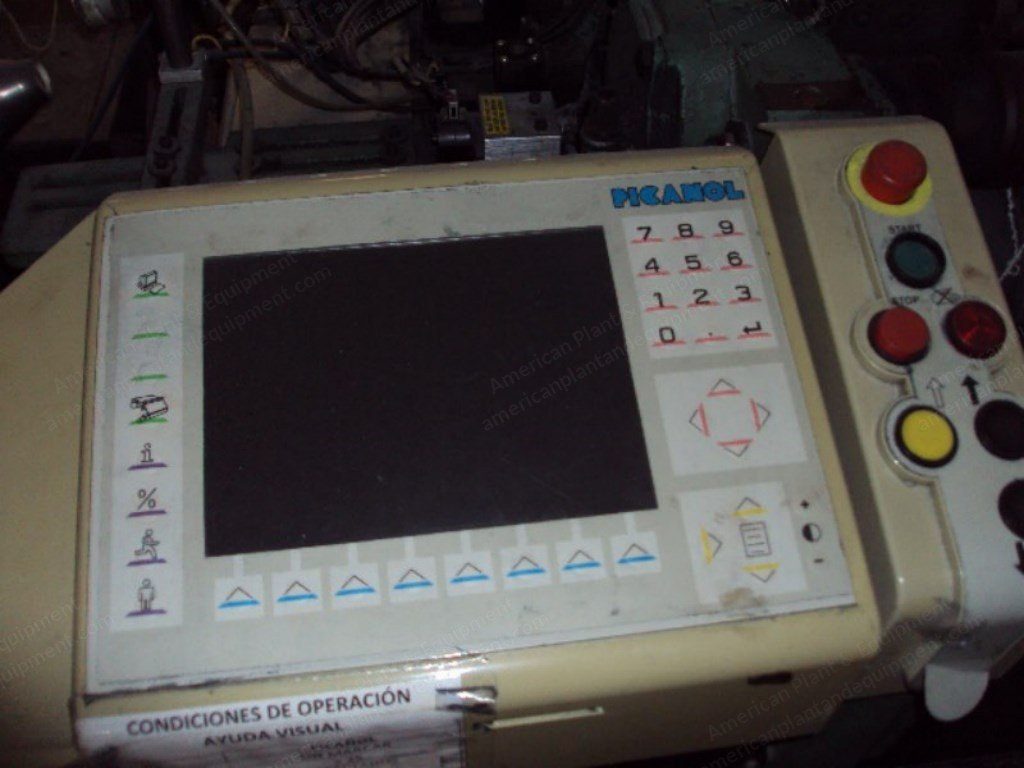 Close-up of the operator control panel on a weaving loom, keypad and color display.