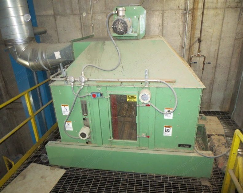 Pellet mill with conditioner and drive guard on a steel platform.
