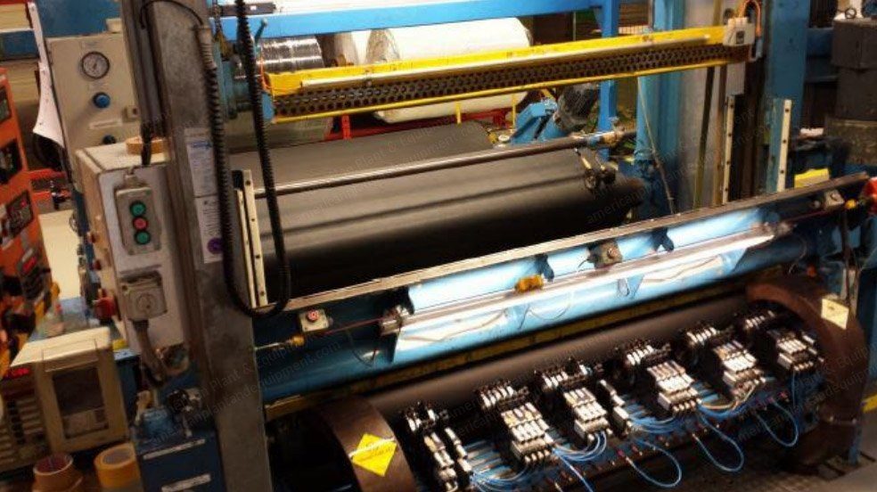 Roll cutting machine with unwind stand and slitting section.