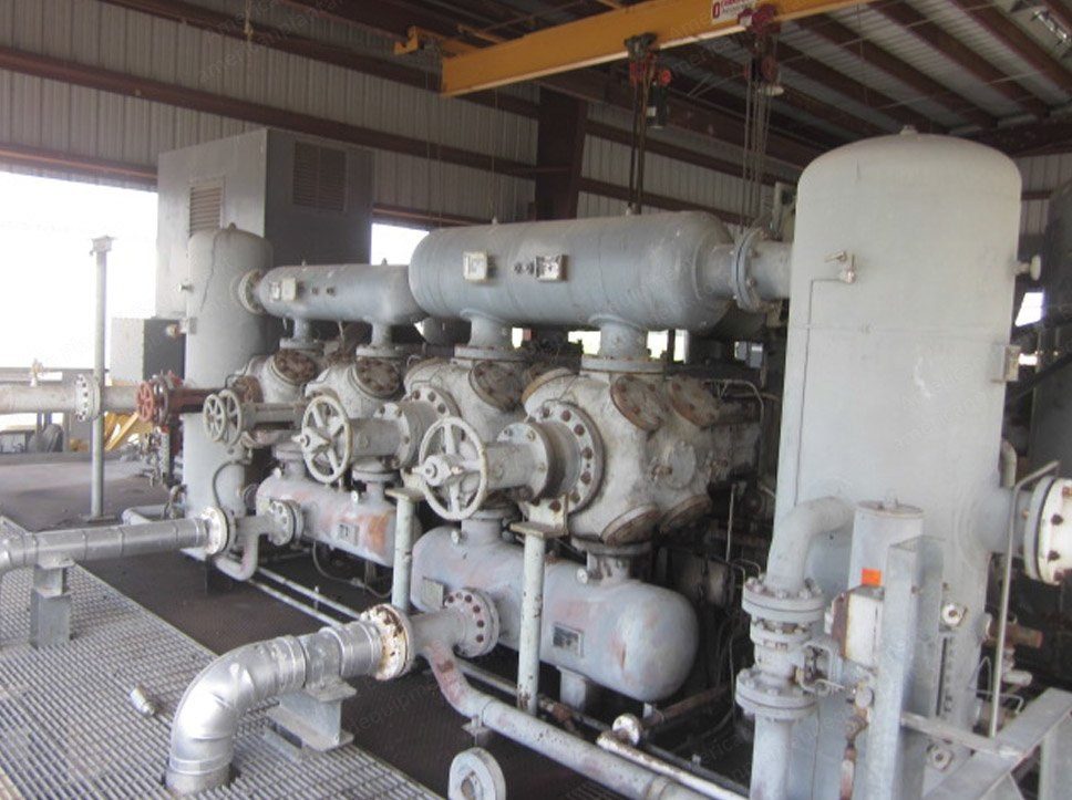 Cryogenic gas processing plant, vessels and insulated piping on a steel skid.